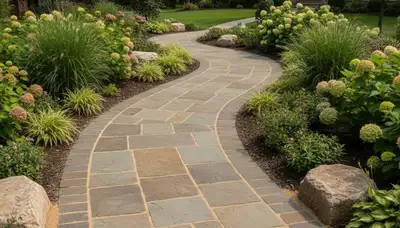Professional stone paver walkway with natural stone and greenery by Chop Chop Landscaping in Bloomington, IN